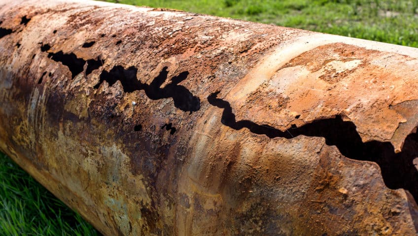 Corrosion occurring on metal cylinder.