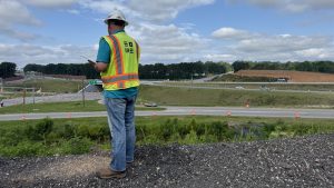 Project manager oversees inspection of highway construction
