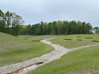 Positive drainage on reclaimed mined lands