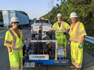 Technicians in high vis gear on roadway
